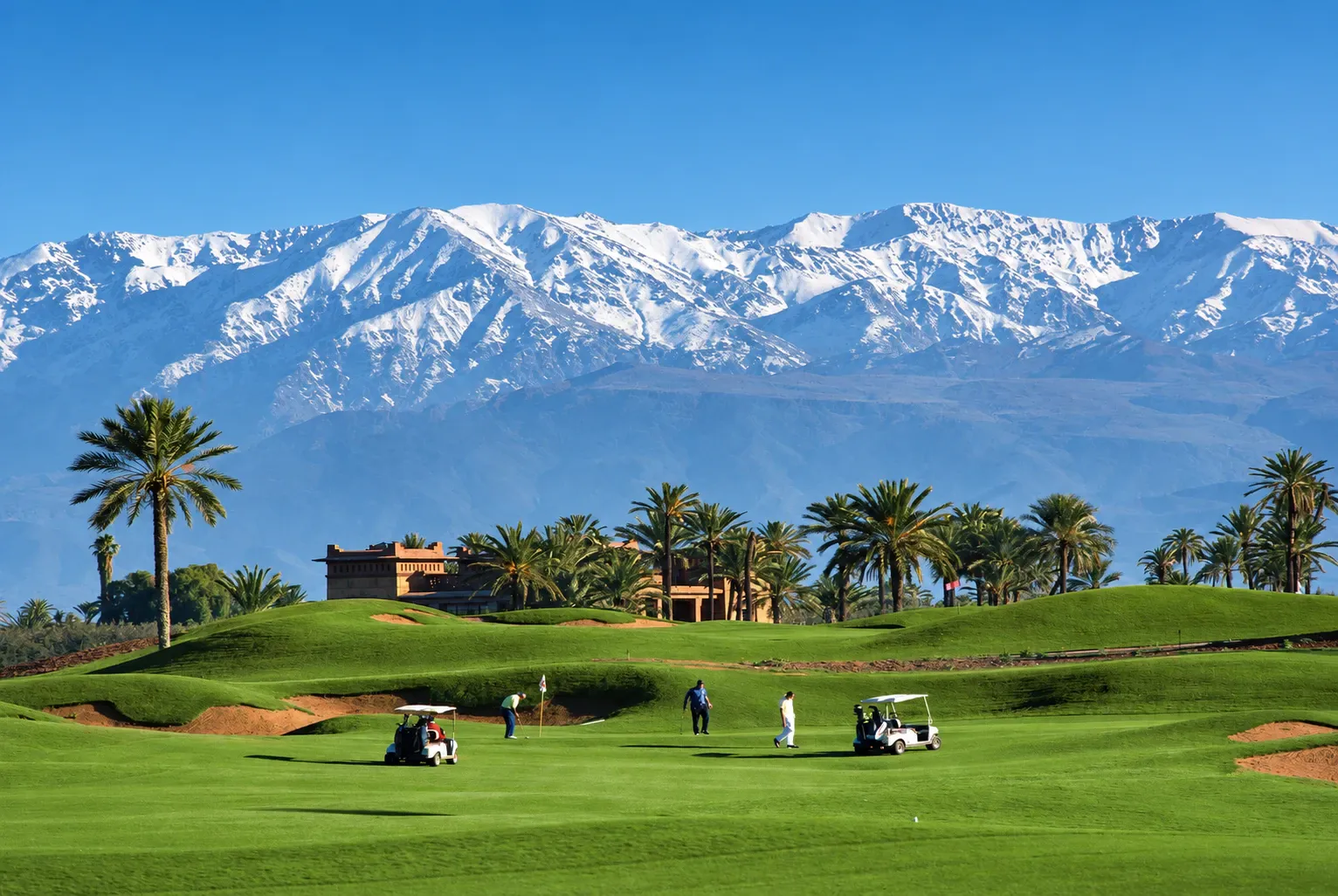 Golf in Marrakech below the snow-capped Atlas Mountains